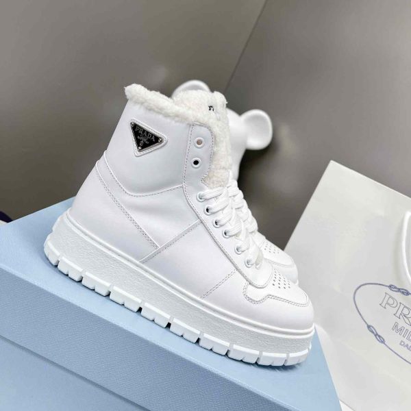 Prada Leather And Shearling High-Top Sneakers